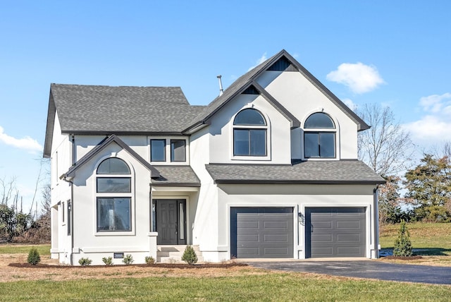 view of front facade featuring a garage and a front yard