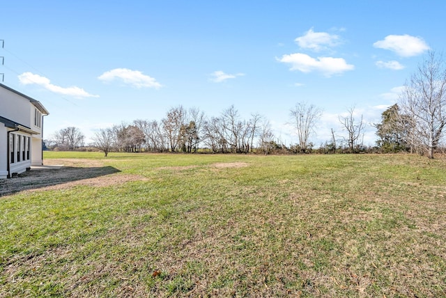 view of yard with a rural view