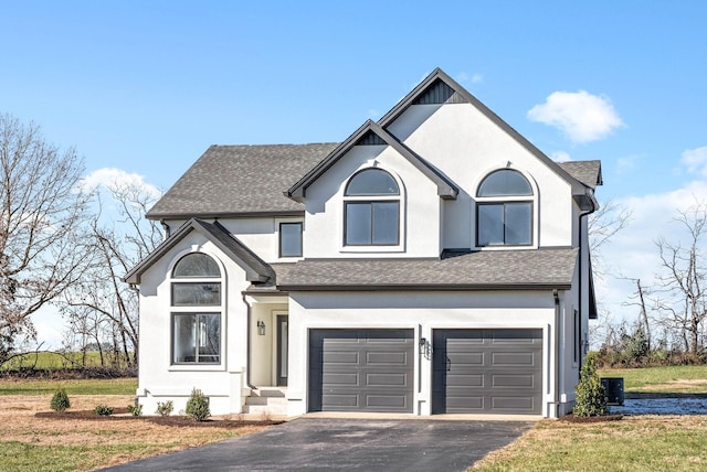 view of front property with a garage and a front lawn