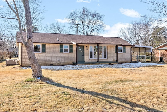 ranch-style home featuring a front yard and a carport