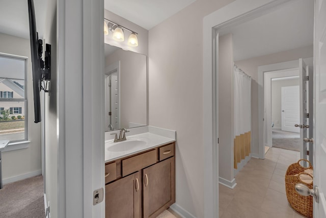 bathroom featuring tile patterned flooring and vanity