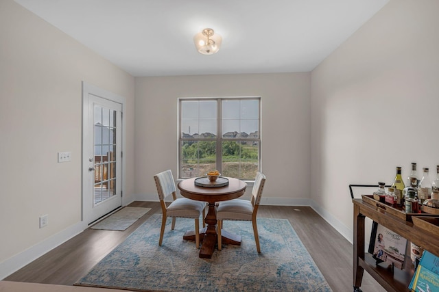 dining area with dark wood-type flooring