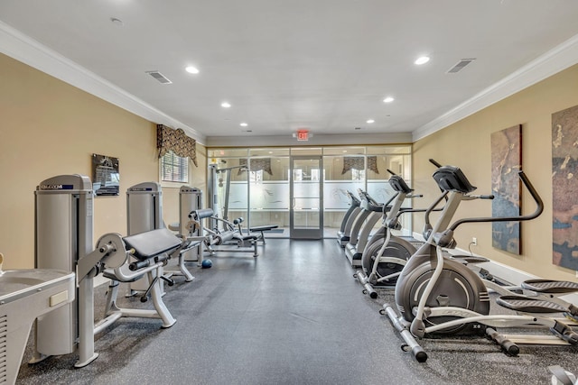 workout area featuring ornamental molding