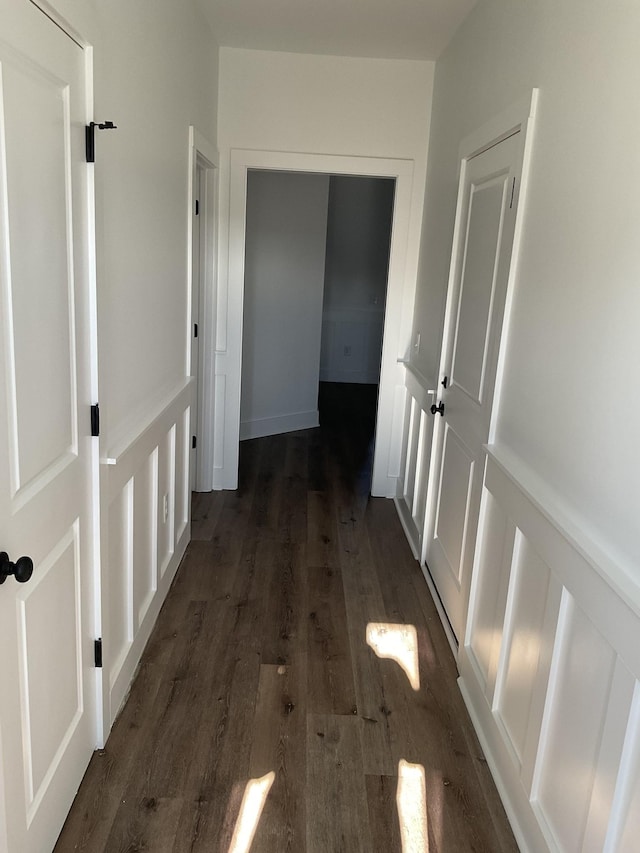 hallway featuring dark hardwood / wood-style flooring