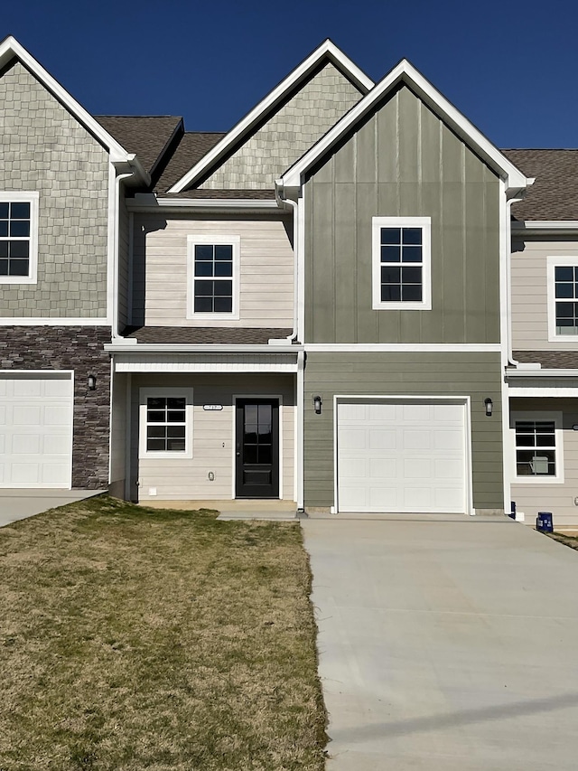 view of front facade with a garage and a front lawn