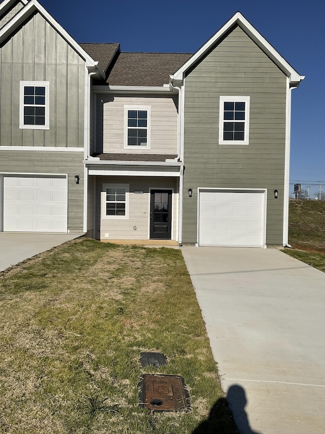 view of front facade featuring a front yard and a garage