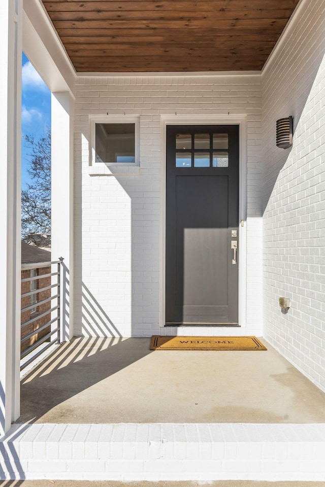 entrance to property with brick siding