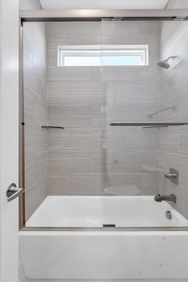 full bath with bath / shower combo with glass door