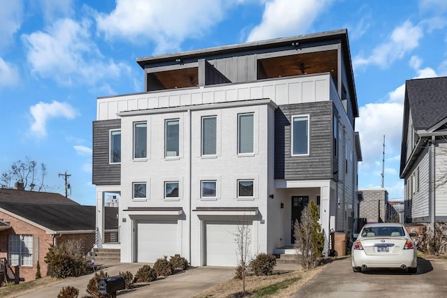 view of front of house featuring brick siding, board and batten siding, concrete driveway, and an attached garage