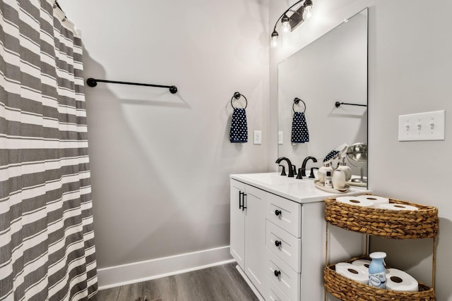 bathroom with wood-type flooring and vanity