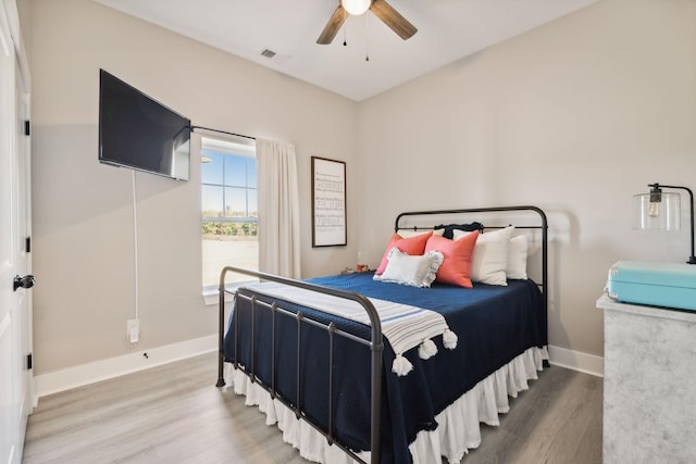 bedroom featuring ceiling fan and wood-type flooring