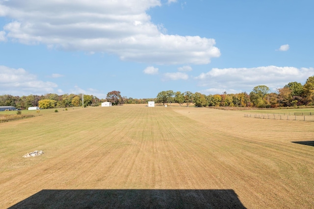 view of yard with a rural view