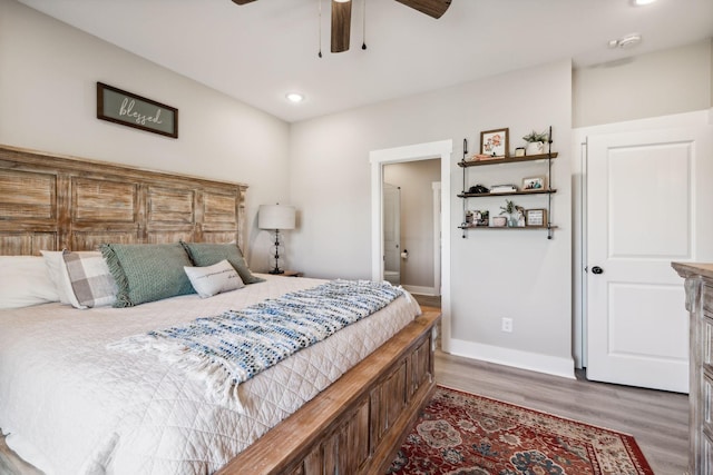 bedroom featuring wood-type flooring and ceiling fan