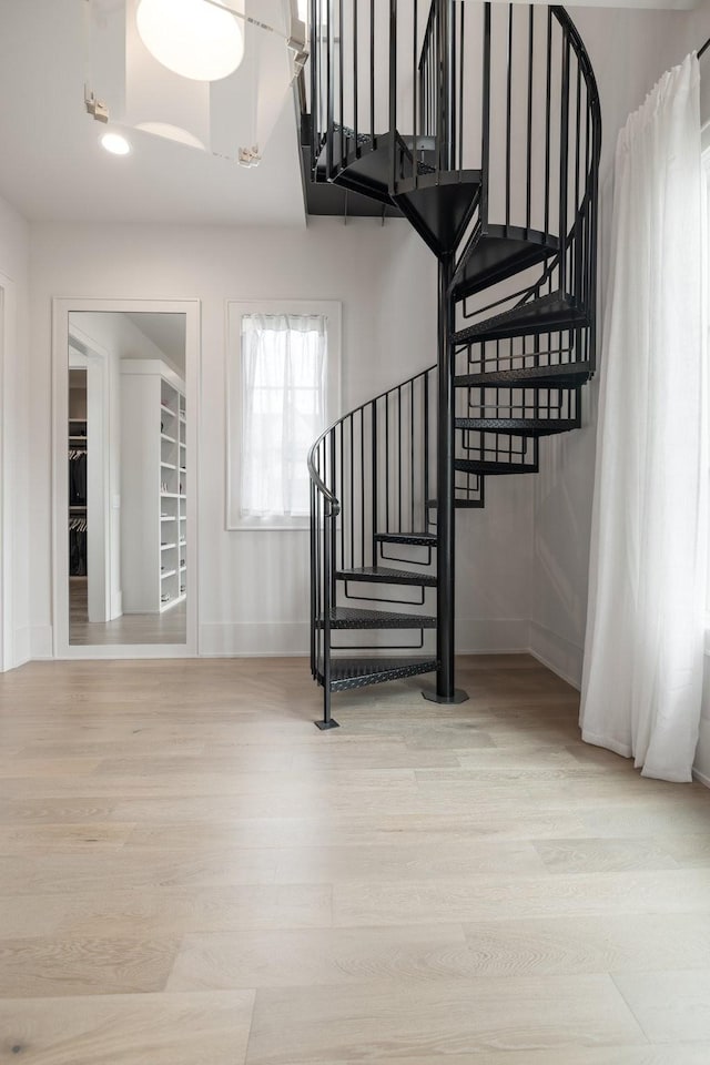 staircase featuring hardwood / wood-style floors