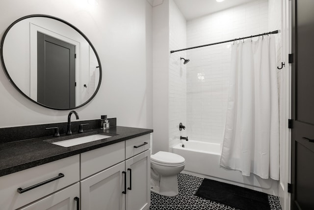 full bathroom with vanity, toilet, and shower / tub combo