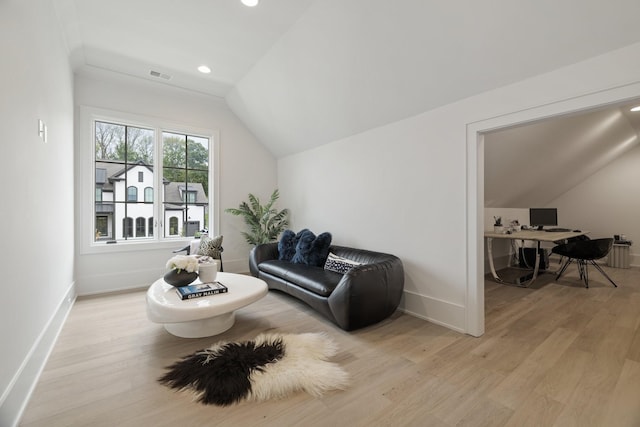 sitting room featuring light hardwood / wood-style flooring and vaulted ceiling