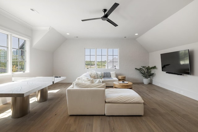 interior space with a healthy amount of sunlight, ceiling fan, and dark wood-type flooring