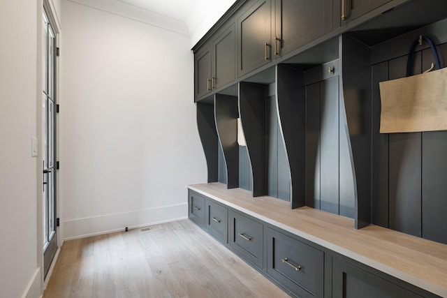 mudroom featuring light hardwood / wood-style floors and ornamental molding