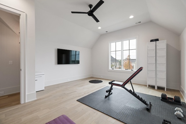 exercise area featuring ceiling fan, light hardwood / wood-style flooring, and lofted ceiling