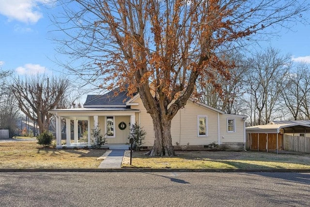 view of front of property with a porch and a carport