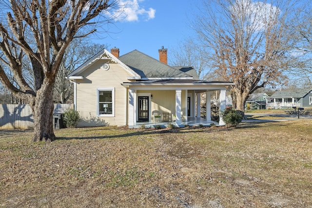 view of front of house featuring a porch and a front lawn