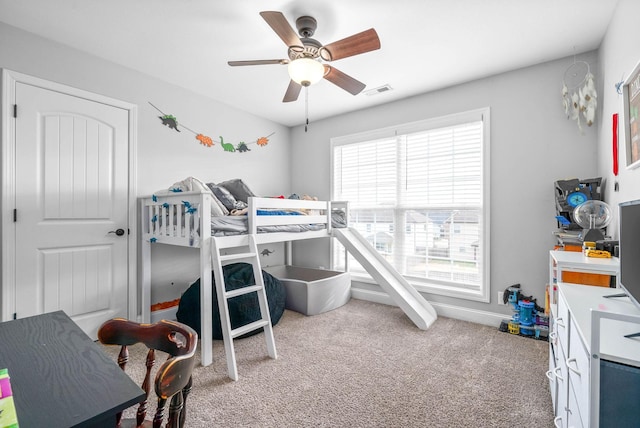 carpeted bedroom with ceiling fan