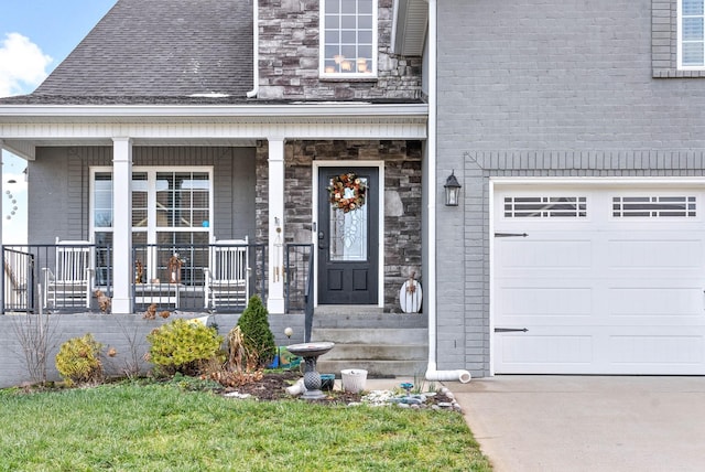 entrance to property with a porch and a garage