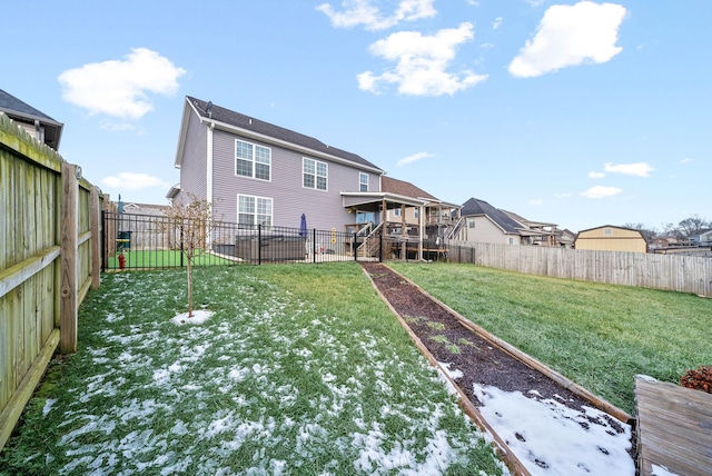 rear view of house with a yard