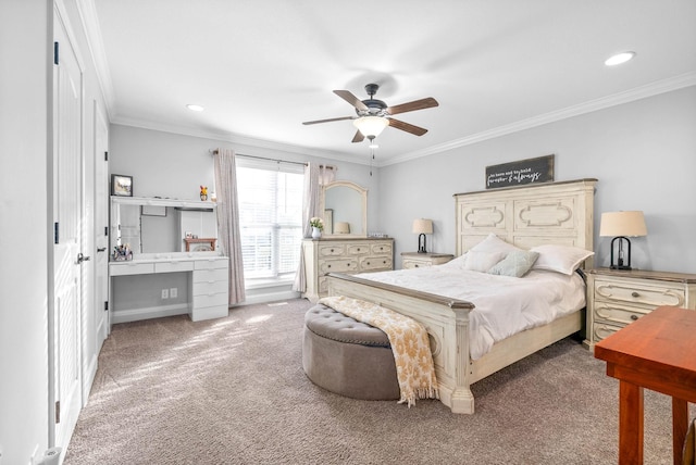 carpeted bedroom with ornamental molding and ceiling fan