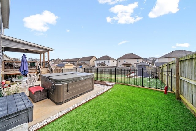 view of yard featuring a patio and a hot tub