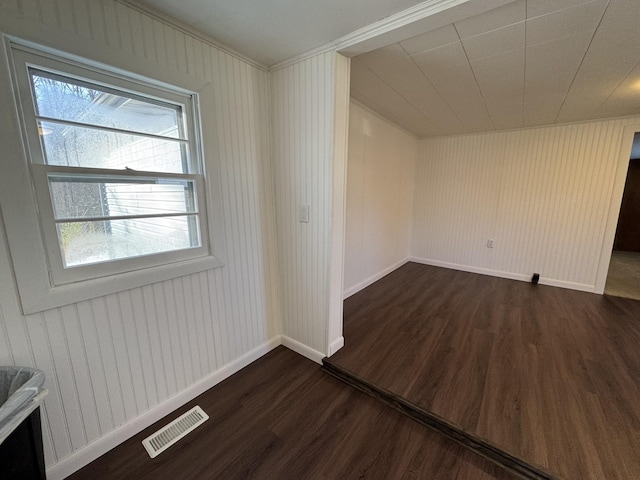 spare room featuring dark hardwood / wood-style floors