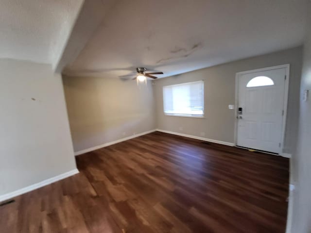 foyer featuring dark hardwood / wood-style flooring and ceiling fan