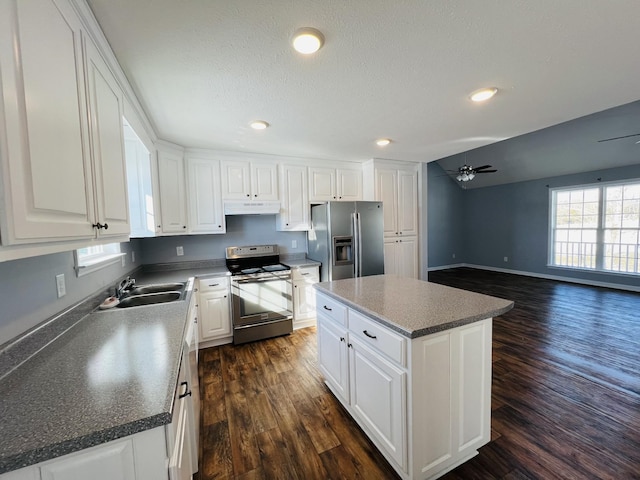 kitchen featuring sink, a kitchen island, white cabinets, and appliances with stainless steel finishes