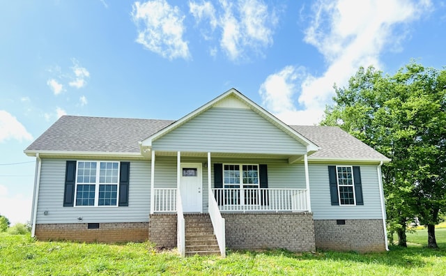 single story home featuring a front lawn and a porch