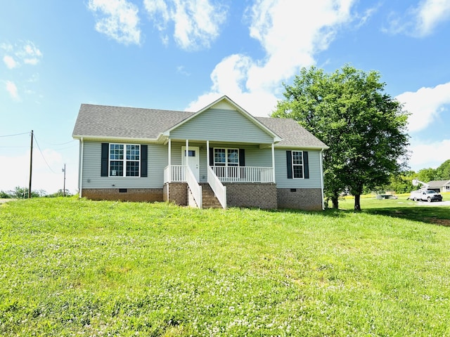 view of front of home featuring covered porch and a front lawn