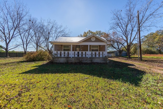 view of front of home with a porch and a front lawn