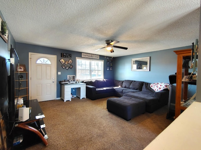 carpeted living room with ceiling fan and a textured ceiling