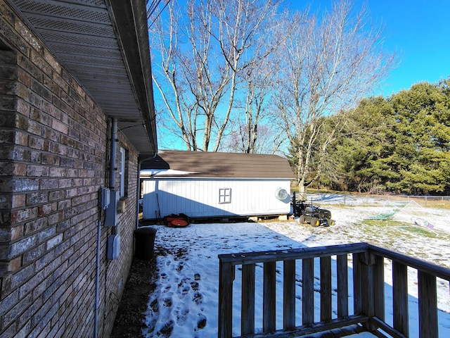 snowy yard with a deck