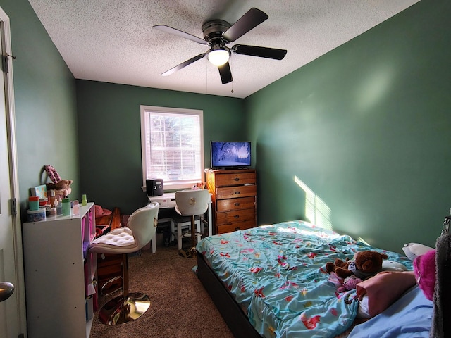 bedroom with ceiling fan, carpet, and a textured ceiling