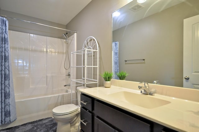 full bathroom featuring toilet, vanity, and shower / bath combo with shower curtain