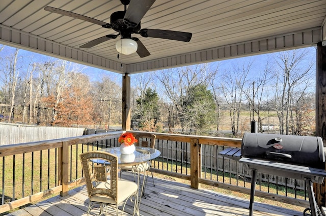 deck with ceiling fan and a lawn