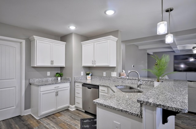 kitchen featuring sink, white cabinets, hanging light fixtures, stainless steel dishwasher, and kitchen peninsula