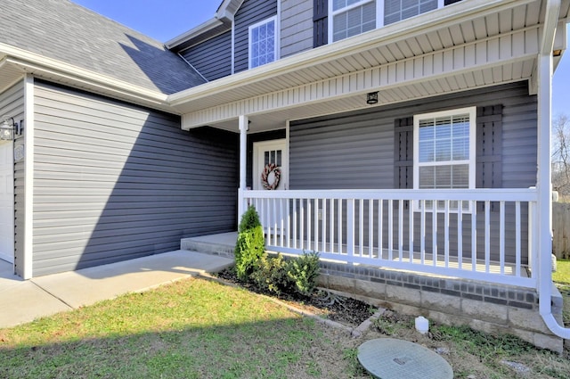 entrance to property featuring a porch