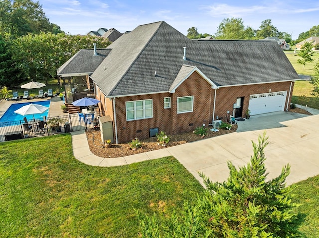 exterior space with a garage and a yard