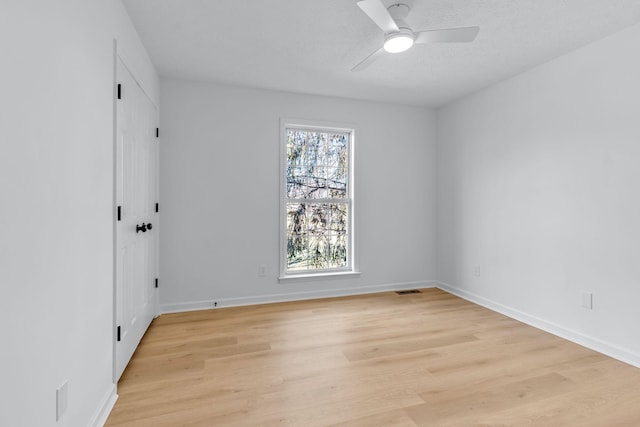 unfurnished room featuring ceiling fan and light wood-type flooring