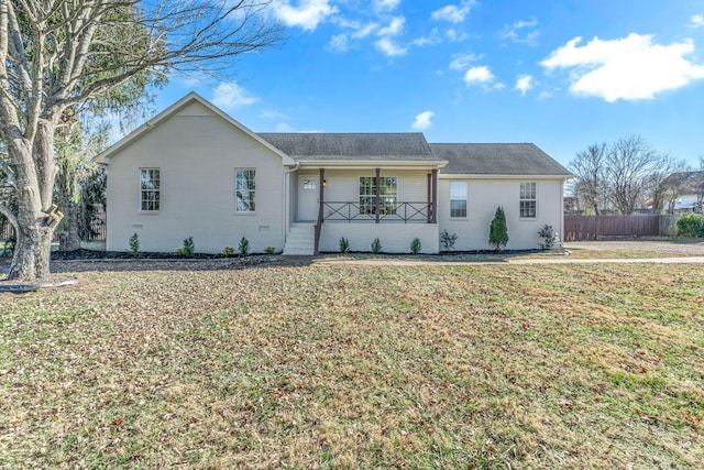 ranch-style house featuring a front yard