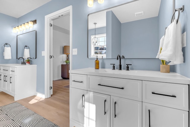 bathroom featuring vanity and hardwood / wood-style floors