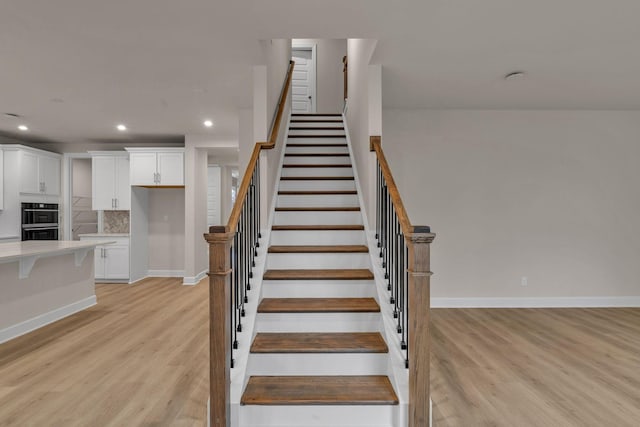 stairway with wood-type flooring