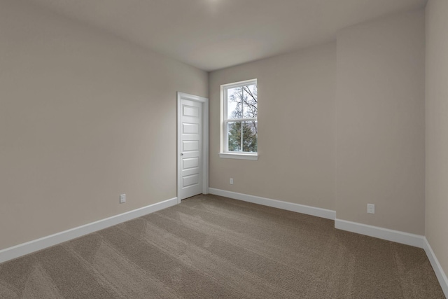 unfurnished room featuring carpet flooring