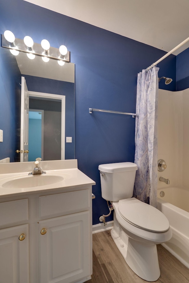 full bathroom featuring wood-type flooring, vanity, toilet, and shower / bathtub combination with curtain